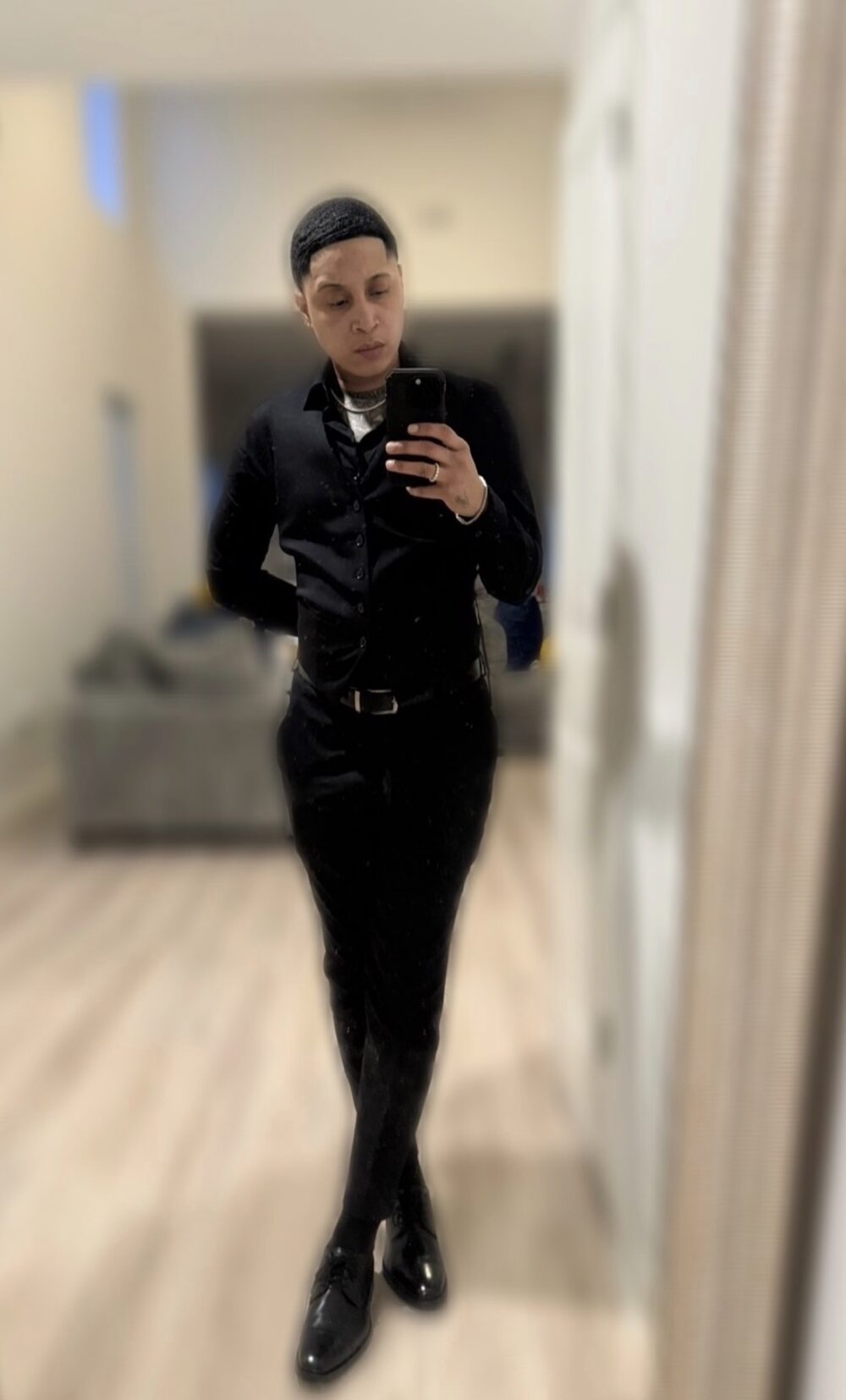 Marie 'Bud' Mobley, Master Barber and owner of Bud Kutz, in her signature all-black