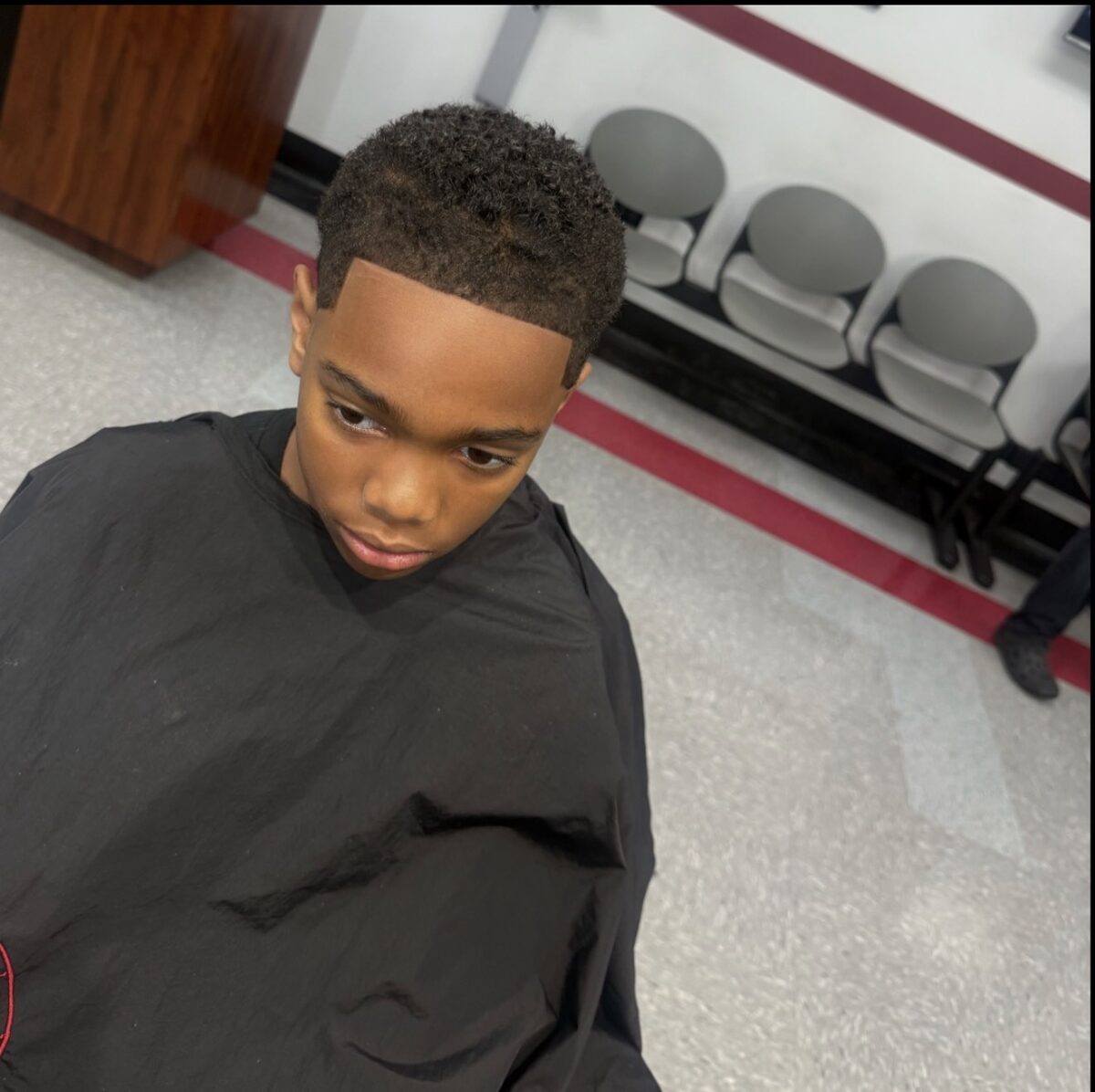 Kids haircut with a clean lineup at Bud Kutz